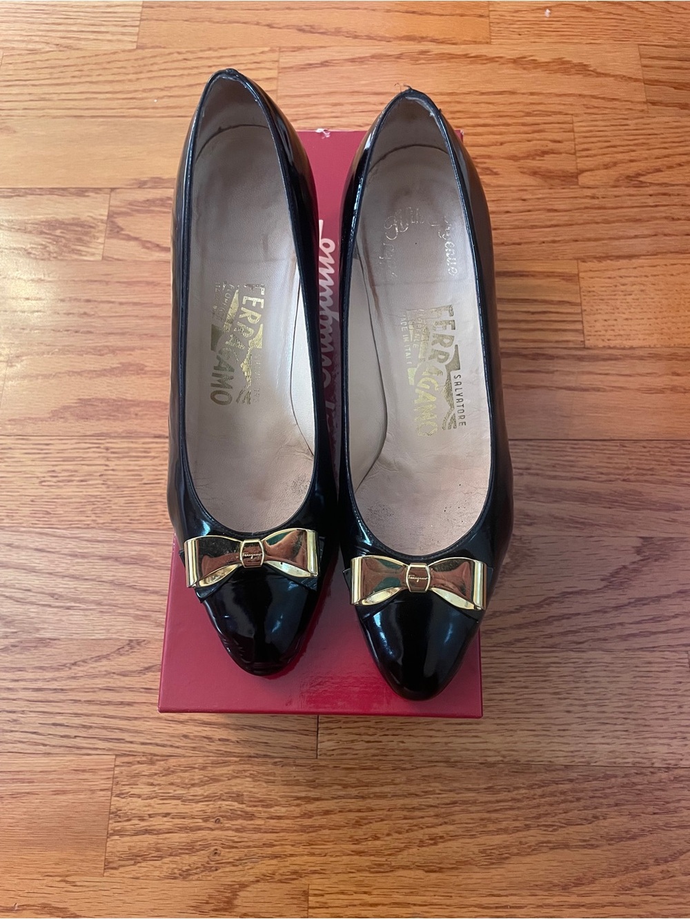 Salvatore Ferragamo Black Patent Leather Pumps with Gold Bow